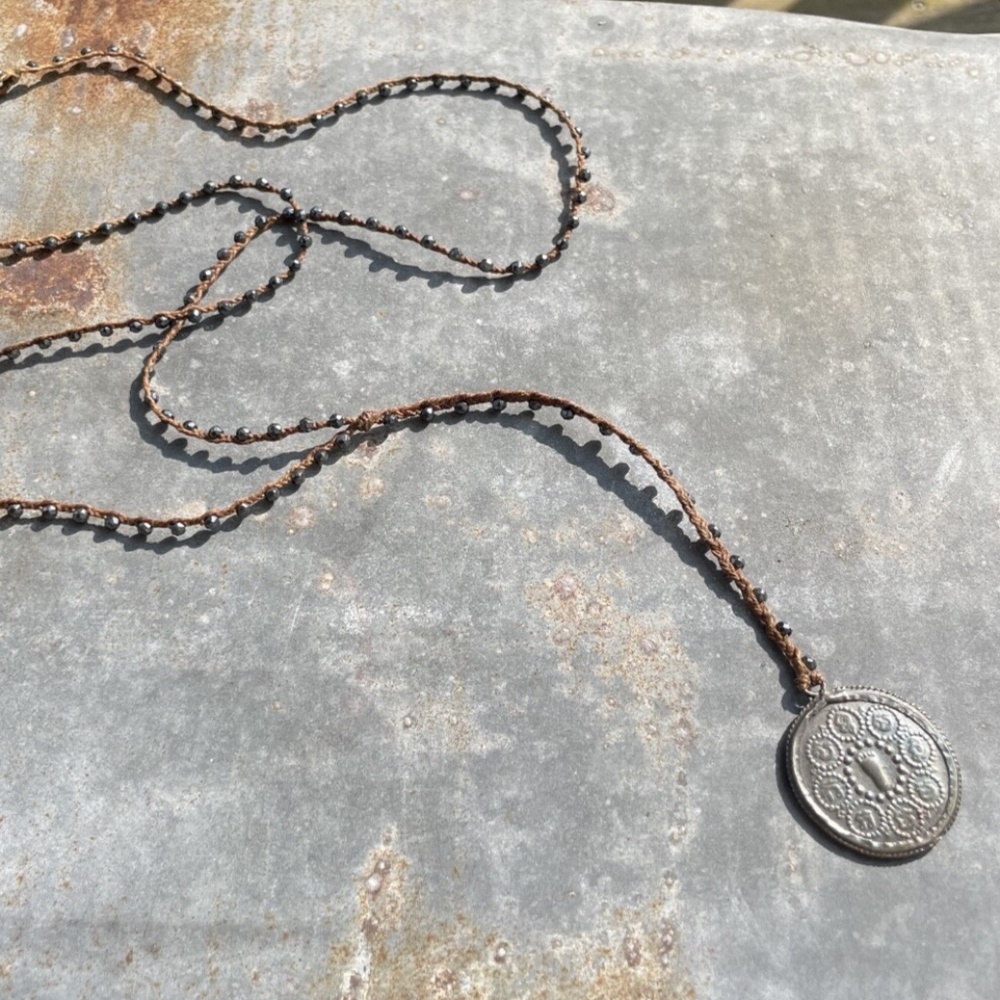Vintage long beaded, braided Necklace w/ silver tone vintage Pendant